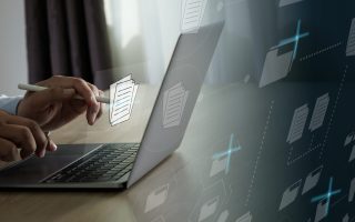 Businessman working reading documents graph financial to job succes Analyze online documentation database Document Management System (DMS)